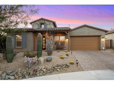 Charming home with a stone facade, desert landscaping, and a cozy front porch at 34801 N 53Rd St # 2, Cave Creek, AZ 85331