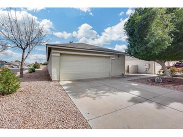 This home features a two-car garage and wide driveway and low-maintenance landscaping at 4725 E Brown Rd # 59, Mesa, AZ 85205