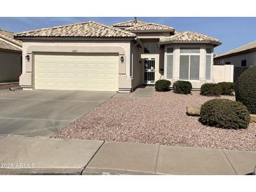 Charming single Gathering home featuring a two-car garage and well-maintained desert landscaping at 10332 W Potter Dr, Peoria, AZ 85382