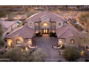 Stunning two-story home with a circular driveway and a meticulously landscaped front yard at 31816 N 19Th Ave, Phoenix, AZ 85085