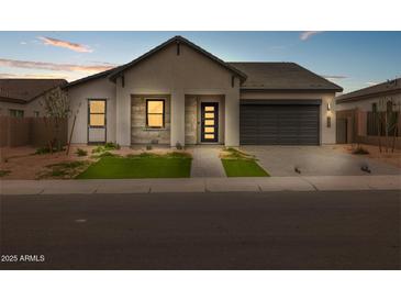 Beautiful single Gathering home featuring a well manicured yard and a two car garage at 34283 N Sandpiper Trl, Queen Creek, AZ 85144