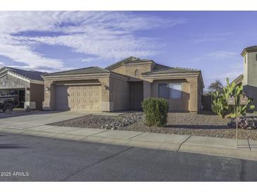 Charming single-story home with desert landscaping and attached two-car garage at 3864 W Fairway Dr, Eloy, AZ 85131