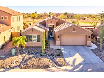 Charming single-story home with a well-manicured rock yard, desert landscaping, and a two-car garage at 42829 W Oakland Dr, Maricopa, AZ 85138