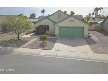 Charming single-Gathering home showcasing a well-manicured front yard and a two-car garage at 655 W Mission Dr, Chandler, AZ 85225