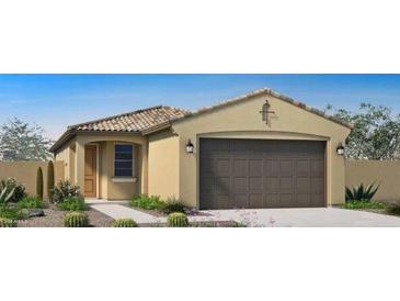 Beautiful single-Gathering home featuring a two-car garage and desert landscaping at 14598 W Wood Dr, Surprise, AZ 85379
