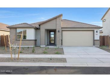 Charming single-story home with neutral tones, desert landscaping, and a convenient two-car garage at 14787 W El Cortez Pl, Surprise, AZ 85387