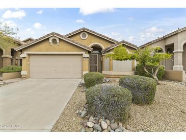 Charming single-story home with a two-car garage and low maintenance desert landscaping at 10226 E Pine Valley Rd, Scottsdale, AZ 85255