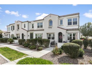 Charming townhome with neat landscaping and a welcoming facade on a sunny day at 2477 W Market Pl # 18, Chandler, AZ 85248