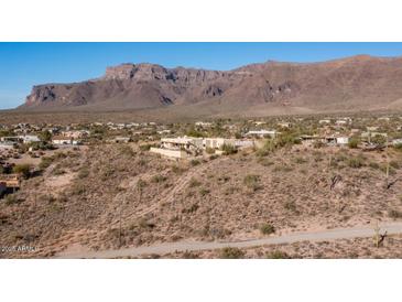 Spacious desert home boasting captivating mountain views and beautiful Southwestern landscaping at 3168 S Yaqui Ln, Gold Canyon, AZ 85118