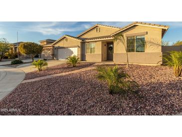 Charming single-story home features well-maintained landscaping and a welcoming entrance at 6404 W Black Hill Rd, Phoenix, AZ 85083