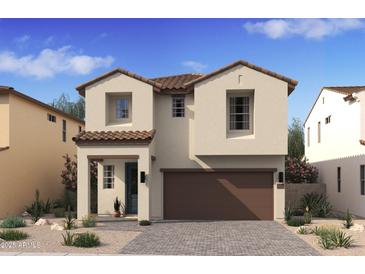 Charming two-story home featuring neutral stucco, a brown roof, and a two-car garage, surrounded by desert landscaping at 7975 W Griswold Rd, Peoria, AZ 85345