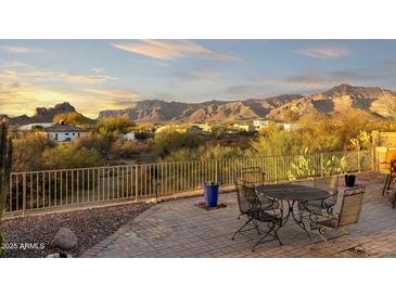 Enjoy this patio with mountain views in the background, perfect for outdoor dining or relaxing under the desert sun at 10322 E Breathless Ave, Gold Canyon, AZ 85118