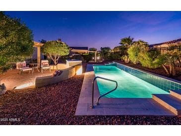 Exterior image featuring a private pool, desert landscaping, and a stone patio at 23236 N Caleta Ct, Sun City West, AZ 85375