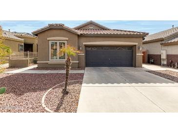 Charming home featuring a well-kept lawn, desert landscaping and an attached two-car garage at 3031 W Cottonwood Ln, Phoenix, AZ 85045