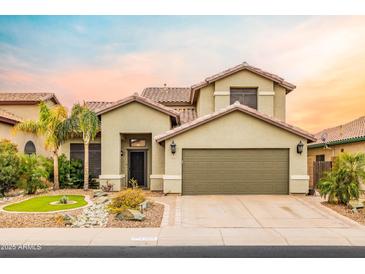 Charming two-story home with a well-manicured lawn and a two-car garage at 4365 E Anderson Dr, Phoenix, AZ 85032