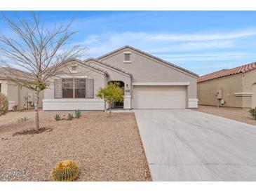 Charming single-story home featuring desert landscaping, neutral stucco, and attached two-car garage at 4718 E Pearl Rd, San Tan Valley, AZ 85143