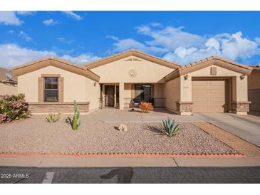 Charming home with a two-car garage, desert landscaping, and a cozy front porch at 2101 S Meridian Rd # 176, Apache Junction, AZ 85120