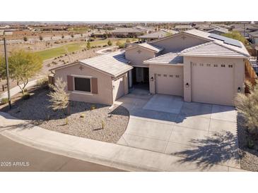 Charming single-story home boasts a three-car garage and a well-maintained desert landscape at 24847 N 175Th Dr, Surprise, AZ 85387