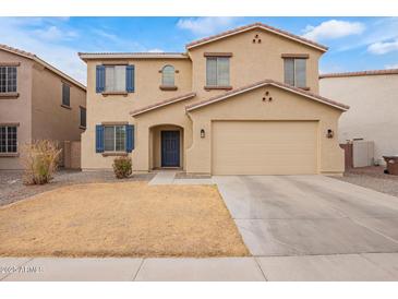 Two story home featuring blue shutters and tan stucco exterior at 28282 N Castle Rock Dr, San Tan Valley, AZ 85143