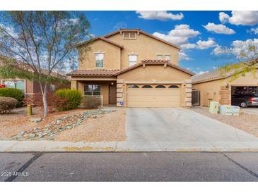 Two-story home featuring a well-manicured yard, covered porch, and a two car garage at 32 W Desert Vista Trl, San Tan Valley, AZ 85143