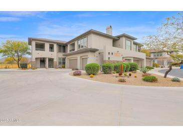 Beautiful two-story condo with desert landscaping, attached garages and private balconies at 33575 N Dove Lakes Dr # 1038, Cave Creek, AZ 85331