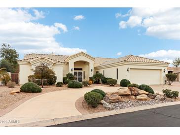 Beautiful single-story home featuring a circular driveway and well-maintained desert landscaping at 6460 E Trailridge Cir # 2, Mesa, AZ 85215