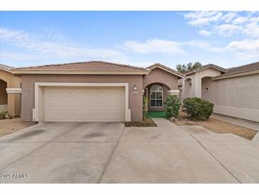 Charming single-story home showcasing a well-kept exterior and a two-car garage at 15203 N 28Th Pl, Phoenix, AZ 85032