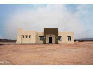 Stunning front exterior showcasing the home's architectural design and desert landscape at 29810 W Bellview St, Buckeye, AZ 85396