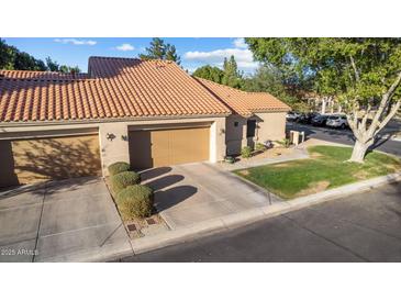 Charming single-story home with a well-maintained tile roof and attached two-car garage at 45 E 9Th Pl # 12, Mesa, AZ 85201