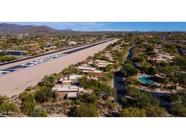 Stunning aerial view of SkyRanch at Carefree homes along a private airstrip runway and serene desert landscape at 8502 E Cave Creek Rd # 10, Carefree, AZ 85377