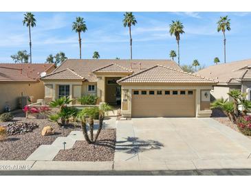 Charming single-story home featuring a tile roof, desert landscaping, and a two-car garage at 3362 N 159Th Ave, Goodyear, AZ 85395