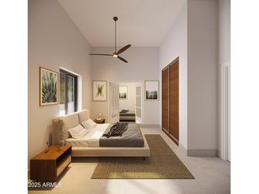 Bright main bedroom featuring contemporary design, ceiling fan and ensuite access at 2075 N Holmes Rd, Apache Junction, AZ 85119