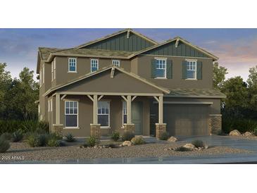 Charming two-story home featuring a covered front porch, two-car garage and desert landscaping at 20756 E Arroyo Verde Dr, Queen Creek, AZ 85142