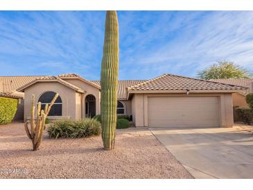 Charming single-story home featuring desert landscaping and a two-car garage at 4637 E Fernwood Ct, Cave Creek, AZ 85331