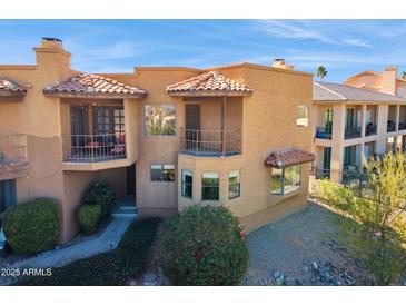 Attractive two-story home featuring stucco siding and a red tile roof with covered balcony at 15834 E Sunflower Dr # 1, Fountain Hills, AZ 85268