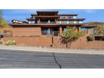 Multi-level home featuring a balcony and desert landscaping at 16210 E Links Dr, Fountain Hills, AZ 85268