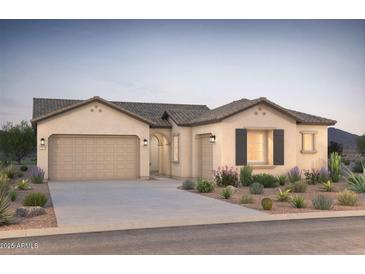 Charming single-story home featuring a two-car garage, beautiful landscaping, and a neutral color palette at 18167 E Colt Dr, Queen Creek, AZ 85142