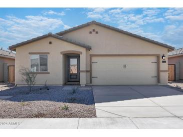 Charming single-story home with a two-car garage and low-maintenance desert landscaping at 24612 W St Catherine Ave, Buckeye, AZ 85326