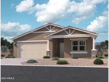 Charming single-story home with a neutral-toned exterior, a two-car garage, and a well-maintained gravel front yard at 15760 W Beryl Ave, Waddell, AZ 85355