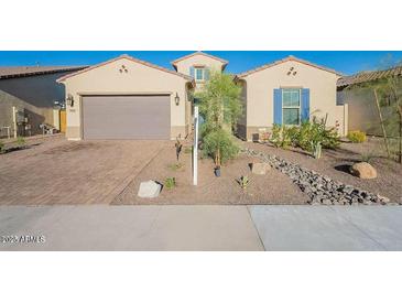 Charming single-story home with a desert-landscaped front yard and a two-car garage at 15843 S 177Th Ave, Goodyear, AZ 85338