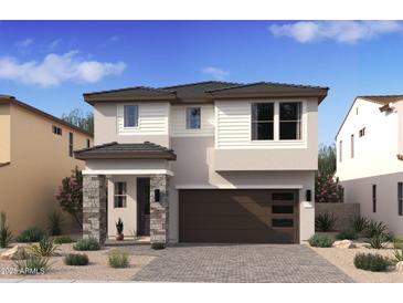 Inviting two-story home featuring stone accents, a modern garage door, and desert landscaping at 7970 W Griswold Rd, Peoria, AZ 85345