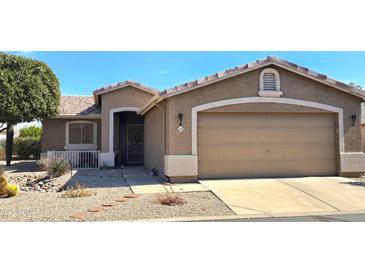 Charming single-story home featuring a well-maintained yard with desert landscaping and neutral tones at 2101 S Meridian Rd # 354, Apache Junction, AZ 85120