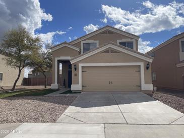 Charming two-story home featuring a neutral color scheme, well-maintained landscaping, and an attached two-car garage at 21805 W Sonora St, Buckeye, AZ 85326