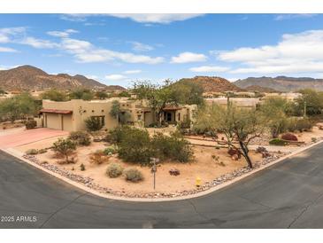 Stunning Southwest home with desert landscaping, mountain views, and a circular driveway at 8540 E Mcdowell Rd # 125, Mesa, AZ 85207