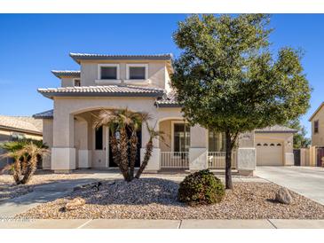 Charming two-story home with landscaped front yard and inviting entrance at 11933 N 140Th Ln, Surprise, AZ 85379