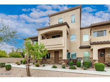 Inviting townhome showing the architecture and front landscaping at 2821 S Skyline Dr # 134, Mesa, AZ 85212