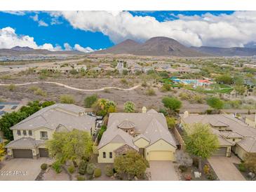 An aerial view of a home showcasing its desert landscaping and proximity to community features at 13344 W Via Caballo Blanco --, Peoria, AZ 85383