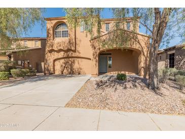 Inviting two-story home boasting a well-maintained yard, neutral stucco, and an attached two-car garage at 13672 W Chaparosa Way, Peoria, AZ 85383