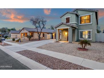 A delightful home showcasing desert landscaping, a two-car garage, and inviting curb appeal at 3360 E Joseph Way, Gilbert, AZ 85295
