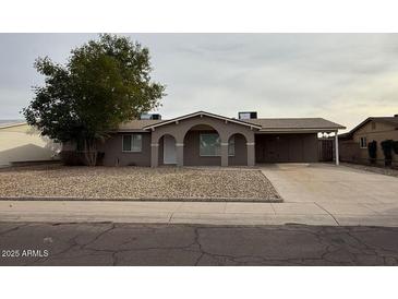 Charming single-story home featuring desert landscaping, covered entryway, and an extended driveway at 3739 W Mission Ln, Phoenix, AZ 85051